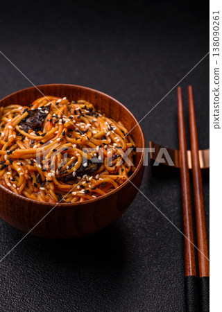 Yakisoba, Asian noodles with vegetables and meat, is a Japanese spicy food. Yakisoba or udon Yakisoba, Asian noodles with vegetables and meat, is a Japanese spicy food. Yakisoba or udon 138090261