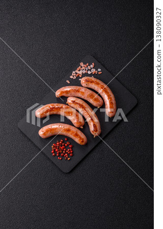 Grilled pork or chicken sausages, smoked fried food with salt and spices. Grilled sausages 138090327