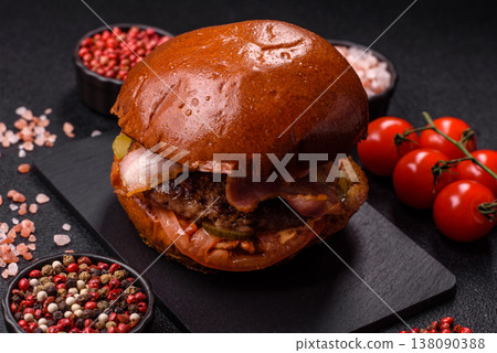 A burger with a patty, cheese, vegetables, and sauce. A burger with meat A burger with a patty, cheese, vegetables, and sauce. A burger with meat 138090388