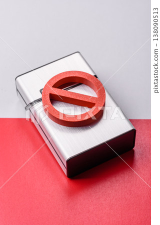 A metal cigarette box with a no smoking sign depicts a harmful habit. A cigarette box A metal cigarette box with a no smoking sign depicts a harmful habit. A cigarette box 138090513