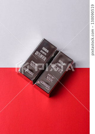 A silver bar, white metal against a backdrop of Polish flag, as a concept. A silver bar A silver bar, white metal against a backdrop of Polish flag, as a concept. A silver bar 138090519