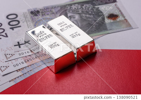 A silver bar, white metal against a backdrop of Polish flag, as a concept. A silver bar 138090521