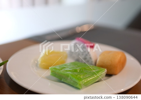 Vietnamese rice cake unwrap sweet jelly desserts jackfruit snack buffet vibrant street food culture colorful wrapped treats Vietnamese rice cake unwrap sweet jelly desserts jackfruit snack buffet vibrant street food culture colorful wrapped treats 138090644