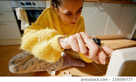 Woman Demonstrates Careful Craftsmanship As She Tightens Screw With Deliberate Precision And Focus Woman Demonstrates Careful Craftsmanship As She Tightens Screw With Deliberate Precision And Focus 138090777