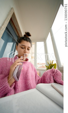 Woman Practices Voice. Young Woman Inhales To Prepare Her Voice For Upcoming Live Broadcast At Window Desk 138090781