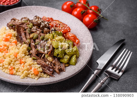 A bowl with beef, porridge, mushrooms, vegetables, sauce, and spices. Beef bowl A bowl with beef, porridge, mushrooms, vegetables, sauce, and spices. Beef bowl 138090903