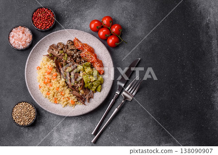 A bowl with beef, porridge, mushrooms, vegetables, sauce, and spices. Beef bowl A bowl with beef, porridge, mushrooms, vegetables, sauce, and spices. Beef bowl 138090907