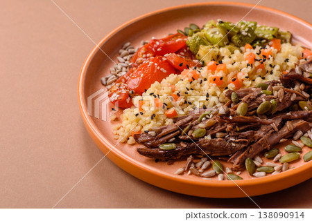 A bowl with beef, porridge, mushrooms, vegetables, sauce, and spices. Beef bowl 138090914