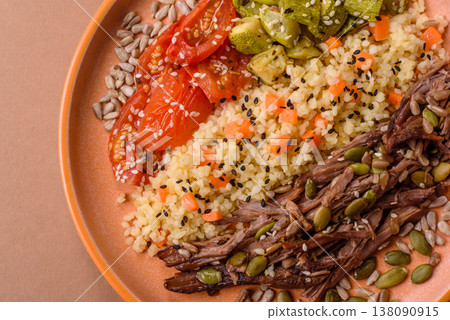 A bowl with beef, porridge, mushrooms, vegetables, sauce, and spices. Beef bowl 138090915