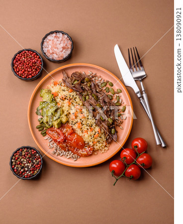 A bowl with beef, porridge, mushrooms, vegetables, sauce, and spices. Beef bowl 138090921