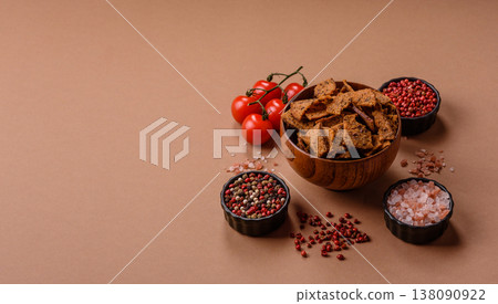 Croutons or crackers made from rye bread with garlic, salt, and spices. Croutons with salt Croutons or crackers made from rye bread with garlic, salt, and spices. Croutons with salt 138090922
