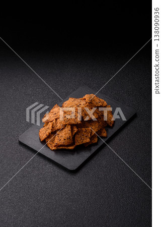 Croutons or crackers made from rye bread with garlic, salt, and spices. Croutons with salt Croutons or crackers made from rye bread with garlic, salt, and spices. Croutons with salt 138090936