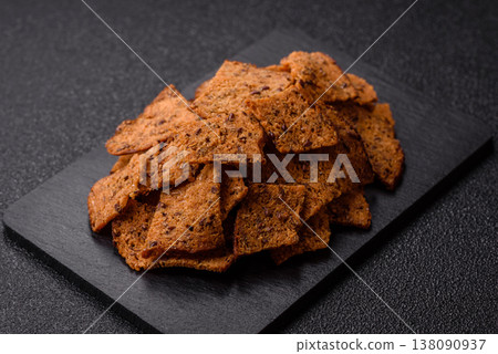 Croutons or crackers made from rye bread with garlic, salt, and spices. Croutons with salt Croutons or crackers made from rye bread with garlic, salt, and spices. Croutons with salt 138090937