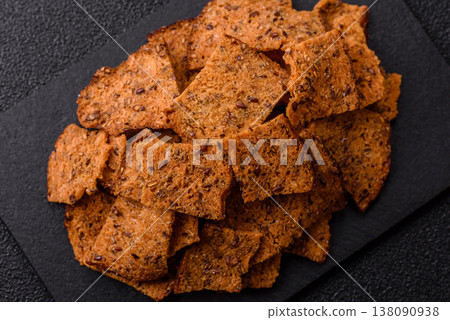 Croutons or crackers made from rye bread with garlic, salt, and spices. Croutons with salt 138090938