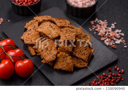 Croutons or crackers made from rye bread with garlic, salt, and spices. Croutons with salt Croutons or crackers made from rye bread with garlic, salt, and spices. Croutons with salt 138090940