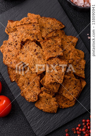 Croutons or crackers made from rye bread with garlic, salt, and spices. Croutons with salt Croutons or crackers made from rye bread with garlic, salt, and spices. Croutons with salt 138090941