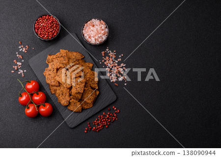 Croutons or crackers made from rye bread with garlic, salt, and spices. Croutons with salt Croutons or crackers made from rye bread with garlic, salt, and spices. Croutons with salt 138090944