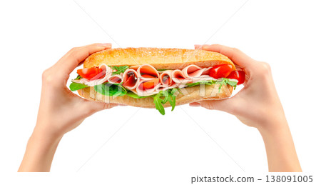 Ham sandwich in hands isolated on white background, deli lunch with tomato and arugula 138091005