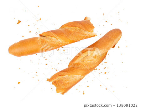 Broken baguette pieces with crumbs isolated on white background, French bread composition Broken baguette pieces with crumbs isolated on white background, French bread composition 138091022