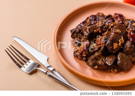 Chicken, duck, or goose liver with plums, onions, and spices. Chicken liver 138091093