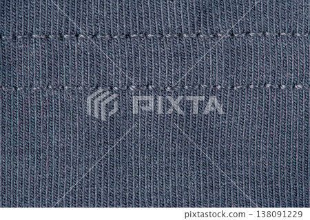 Knitted fabric dark blue macro photo as a background. 138091229
