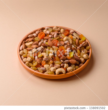 A mix of nuts and dried fruits as ingredients for a healthy meal. Nuts and dried fruits A mix of nuts and dried fruits as ingredients for a healthy meal. Nuts and dried fruits 138091502
