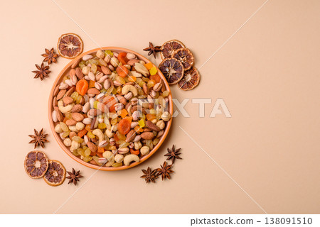 A mix of nuts and dried fruits as ingredients for a healthy meal. Nuts and dried fruits 138091510