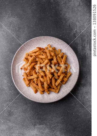 Croutons or crackers made from rye bread with garlic, salt, and spices. Croutons with salt Croutons or crackers made from rye bread with garlic, salt, and spices. Croutons with salt 138091526