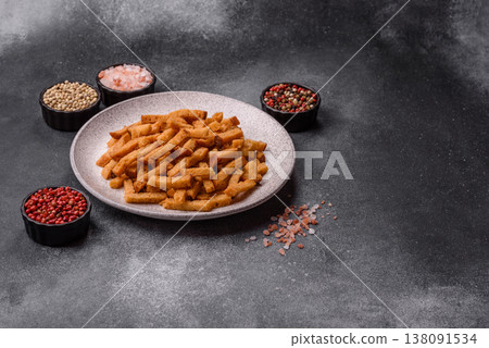 Croutons or crackers made from rye bread with garlic, salt, and spices. Croutons with salt Croutons or crackers made from rye bread with garlic, salt, and spices. Croutons with salt 138091534