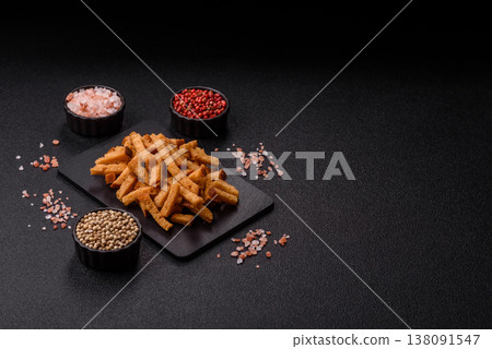 Croutons or crackers made from rye bread with garlic, salt, and spices. Croutons with salt Croutons or crackers made from rye bread with garlic, salt, and spices. Croutons with salt 138091547