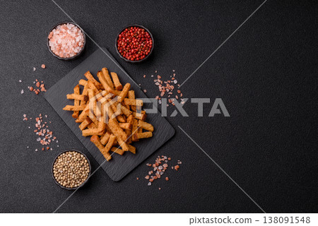 Croutons or crackers made from rye bread with garlic, salt, and spices. Croutons with salt Croutons or crackers made from rye bread with garlic, salt, and spices. Croutons with salt 138091548