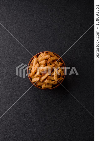 Croutons or crackers made from rye bread with garlic, salt, and spices. Croutons with salt Croutons or crackers made from rye bread with garlic, salt, and spices. Croutons with salt 138091551