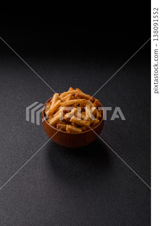 Croutons or crackers made from rye bread with garlic, salt, and spices. Croutons with salt Croutons or crackers made from rye bread with garlic, salt, and spices. Croutons with salt 138091552