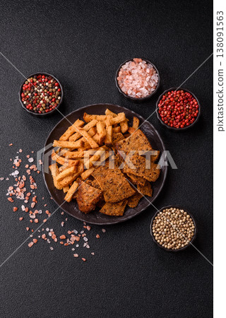 Croutons or crackers made from rye bread with garlic, salt, and spices. Croutons with salt 138091563