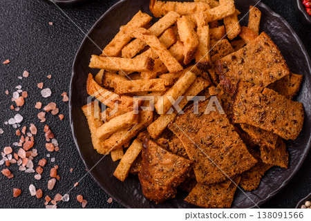Croutons or crackers made from rye bread with garlic, salt, and spices. Croutons with salt Croutons or crackers made from rye bread with garlic, salt, and spices. Croutons with salt 138091566