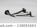Unique old iron nails crafted by hand showcasing artisan skill in metalwork from a historical period 138091663