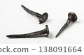 Antique metal nails showcase craftsmanship from a bygone era, highlighting historical tool use and construction techniques 138091664