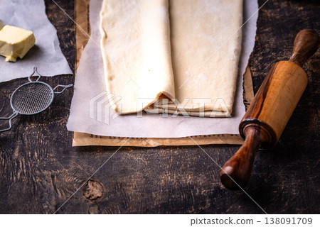Raw puff pastry dough with baking ingredient Raw puff pastry dough with baking ingredient 138091709