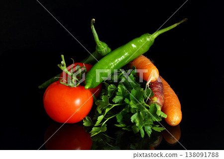 Isolated peppers and juicy cherry tomatoes. black backgorund. Isolated peppers and juicy cherry tomatoes. black backgorund. 138091788