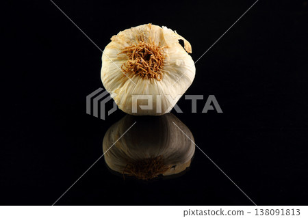 Still life of garlic bulb in dark black background with copy space, It is a herbal food popular Asian. 138091813