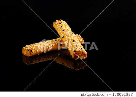 Bread sticks with mix of seeds on black background Bread sticks with mix of seeds on black background 138091837