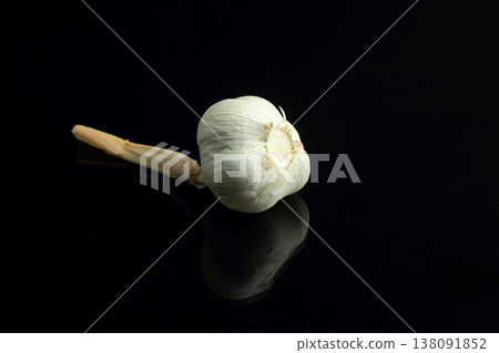 Still life of garlic bulb in dark black background with copy space, It is a herbal food popular Asian. Still life of garlic bulb in dark black background with copy space, It is a herbal food popular Asian. 138091852