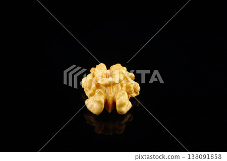 Walnuts with yellow autumn leaves isolated on black background Walnuts with yellow autumn leaves isolated on black background 138091858