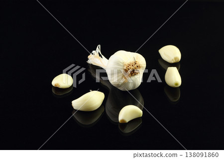 Still life of garlic bulb in dark black background with copy space, It is a herbal food popular Asian. 138091860
