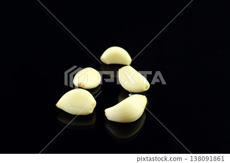 Still life of garlic bulb in dark black background with copy space, It is a herbal food popular Asian. Still life of garlic bulb in dark black background with copy space, It is a herbal food popular Asian. 138091861