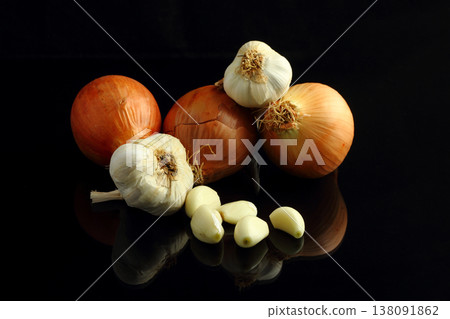 Still life of garlic bulb in dark black background with copy space, It is a herbal food popular Asian. Still life of garlic bulb in dark black background with copy space, It is a herbal food popular Asian. 138091862