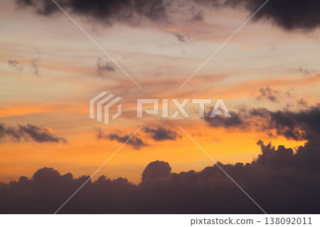 Blurry background of red sunset sky. Dramatic sky with colorful cloud background. Red burning sunset sky. Copy space. 138092011