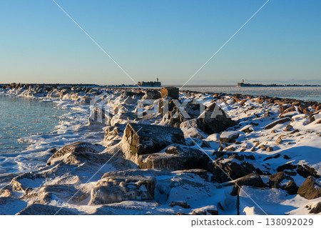 Frozen Baltic Sea at Liepaja Harbor Gate Breakwater with Snow Covered Rocks, Latvia Frozen Baltic Sea at Liepaja Harbor Gate Breakwater with Snow Covered Rocks, Latvia 138092029