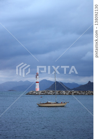 A sailing boat sailing in a stormy weather in Bodrum's Turgutreis district. A sailing boat sailing in a stormy weather in Bodrum's Turgutreis district. 138092130