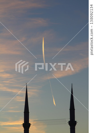 airplane flying in the sky. blue sky background with tiny clouds. 138092134